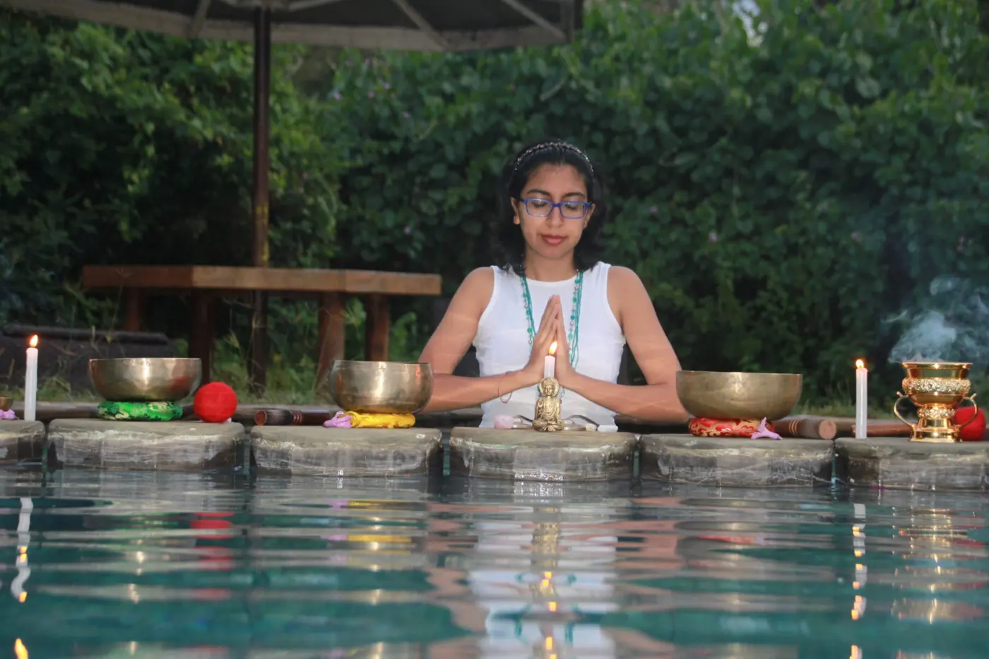 Narissa's singing bowls set up poolside for a luxury wellness experience