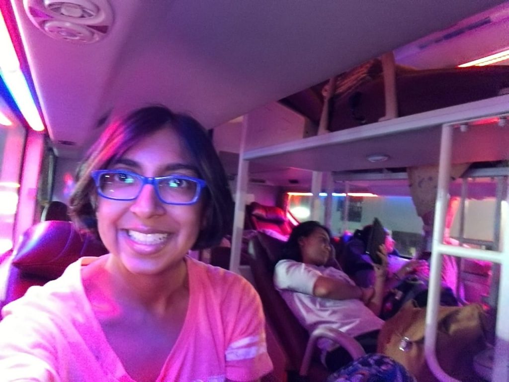 Happy nomad girl on the comfortable sleeper bus from Hanoi to Hue